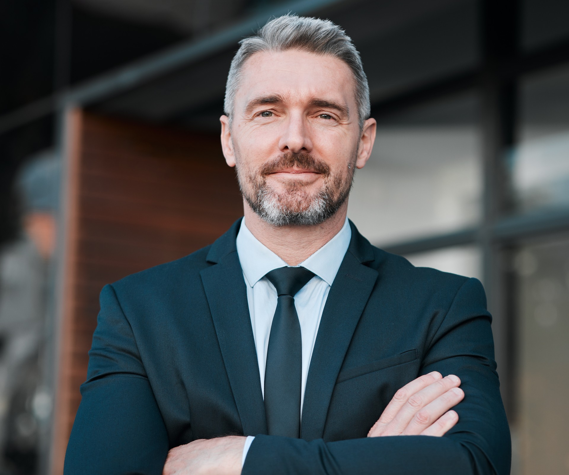Business man, mature and portrait outdoor with arms crossed for professional career and positive attitude. Face of entrepreneur or CEO person with pride, confidence and ambition of corporate boss